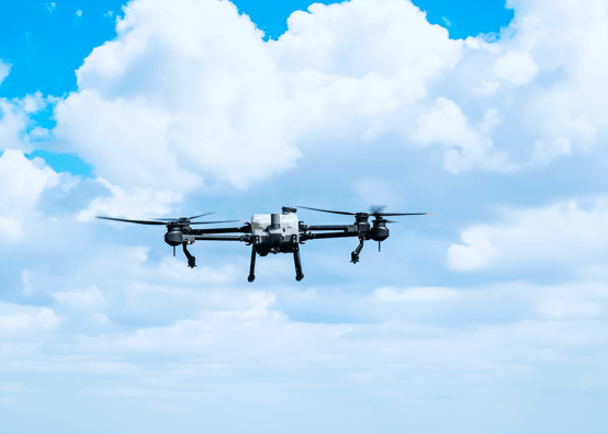 UAV flying with clouds in background